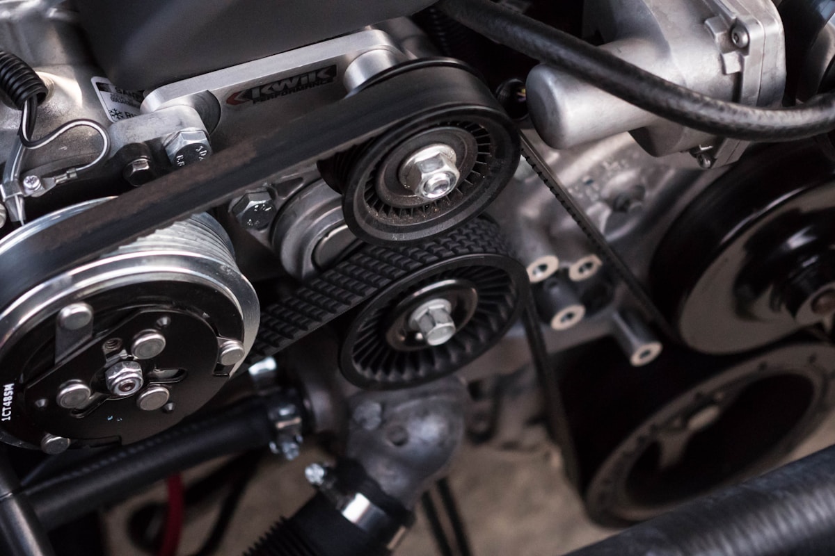 Auto repair shop with mechanic servicing a vehicle