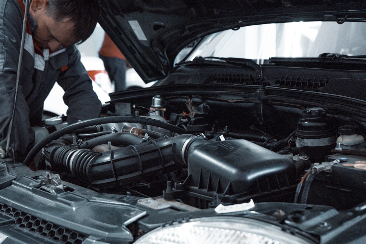 Mechanic inspecting a vehicle brake disc during service