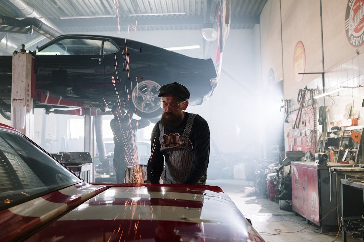 Mechanic performing a vehicle inspection in the shop