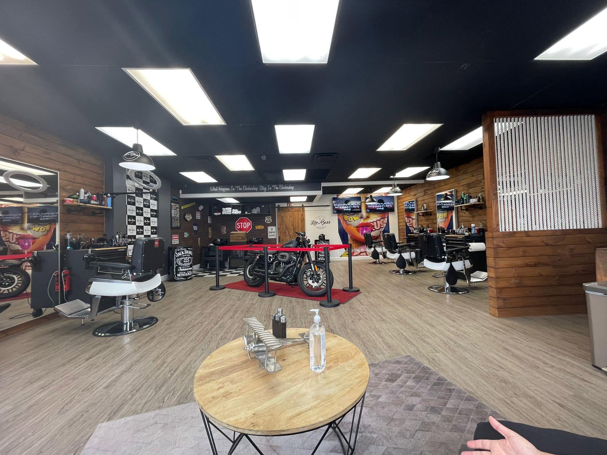 Interior of Like a Boss Barbershop showing barber stations and modern decor